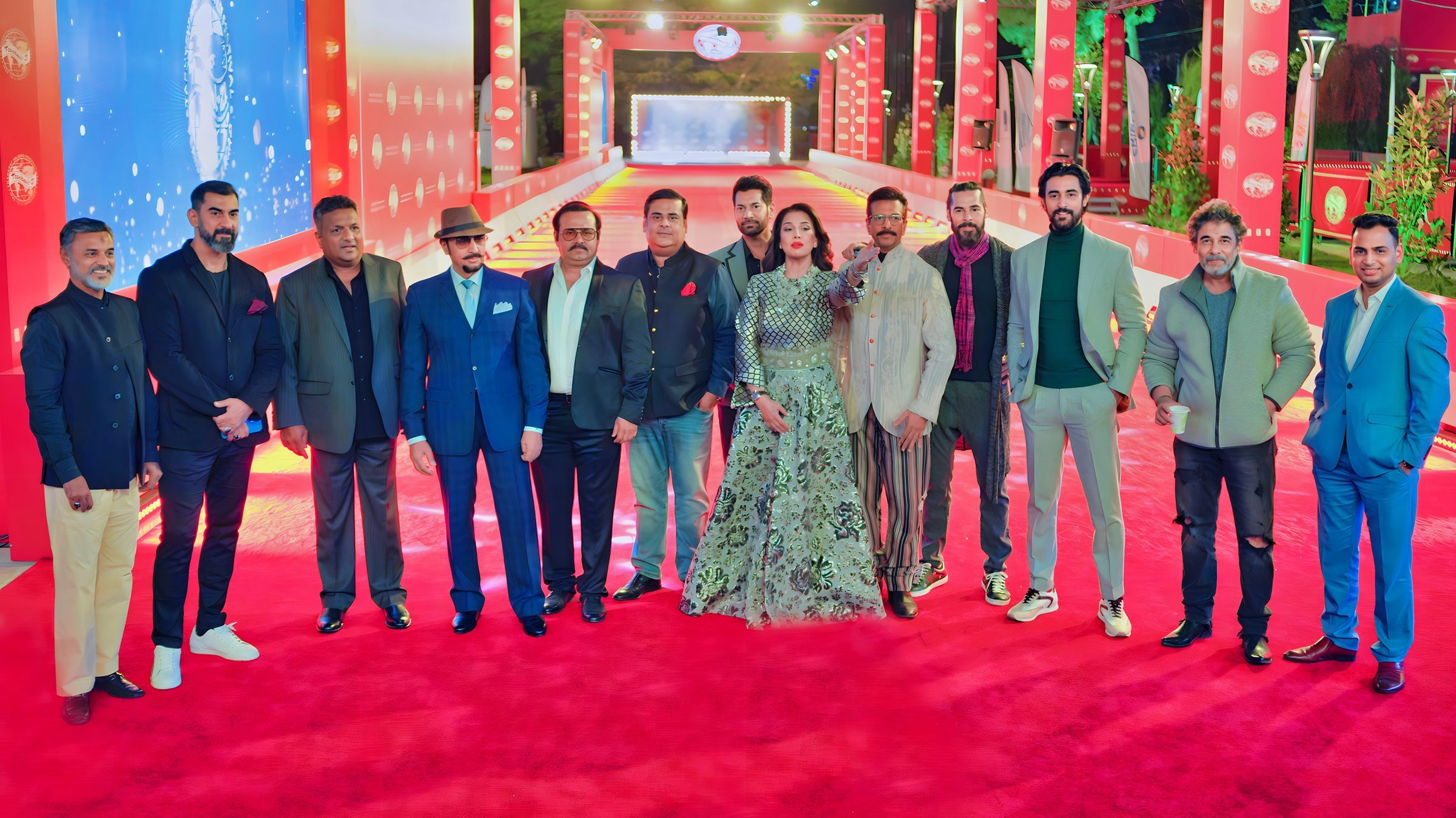Lithvik Mukesh Sharma is photographed with twelve members of the Indian film delegation at the Tashkent Film Festival.
