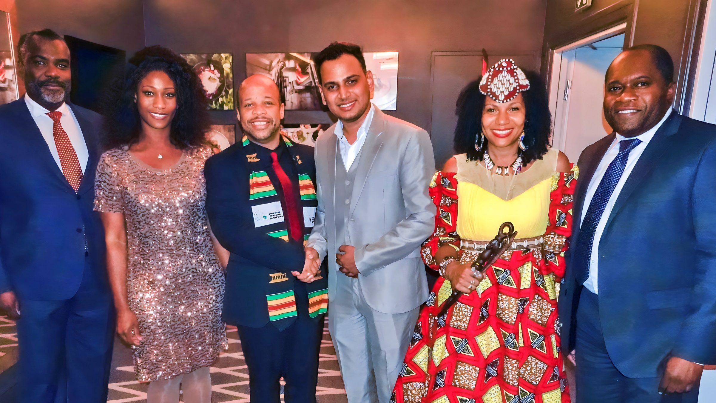 Lithvik Mukesh Sharma is photographed with Cinthia Loïs Ta Thomsen, Dr. Louis-Georges Tin, and Queen Diambi at the African Diaspora summit.