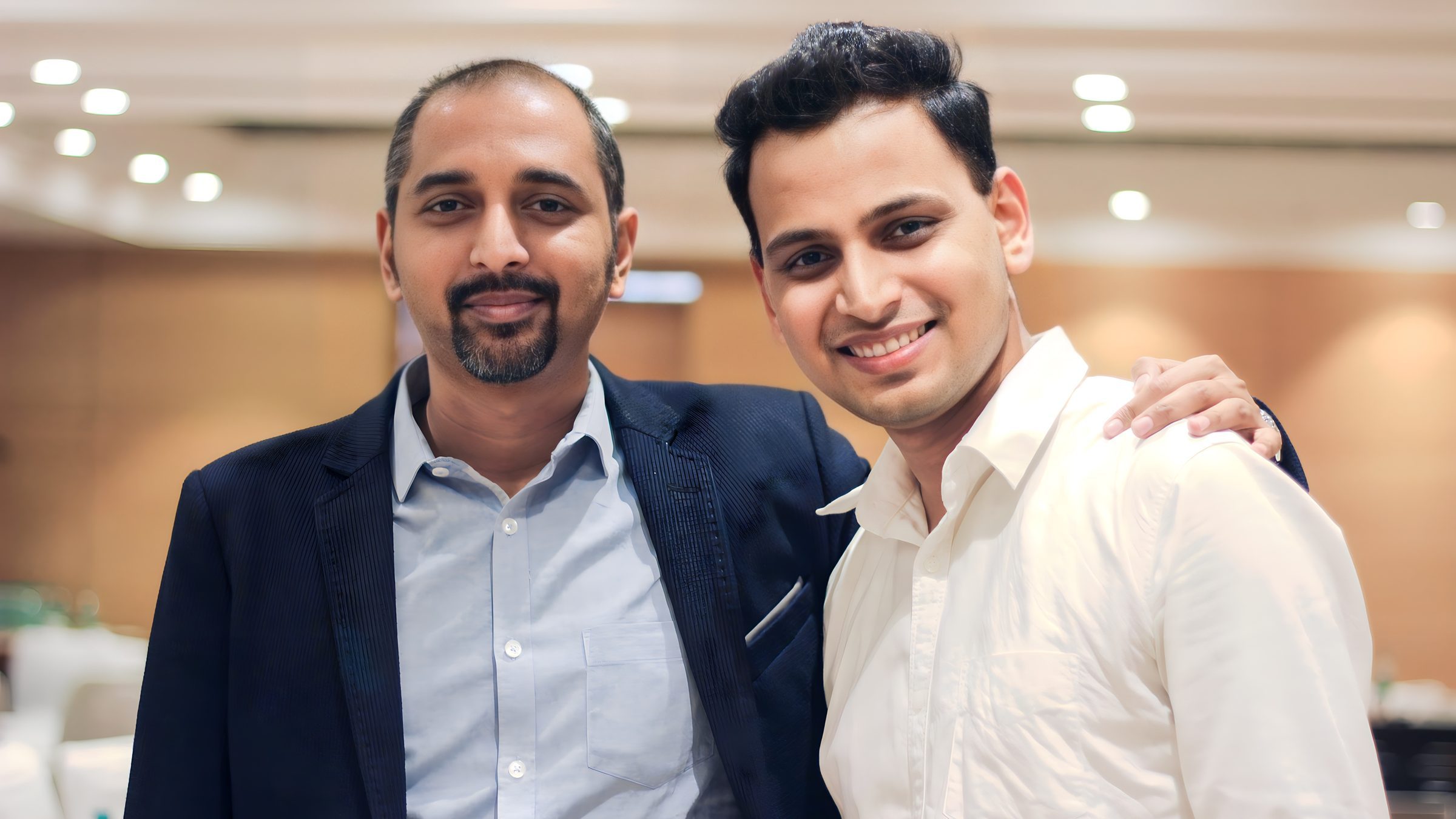 Lithvik Mukesh Sharma is photographed with Rajshekhar Murthy at a business meeting.
